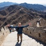 A man riding a skateboard up the side of a mountain