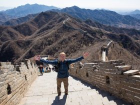 A man riding a skateboard up the side of a mountain